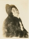 Image of Ahl-ning-wa wife of Arklio. Coat and pants bluish grey.